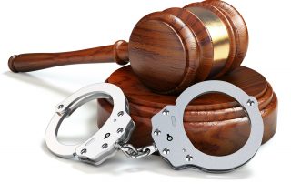 Gavel and handcuffs isolated oin white background. Law and justi