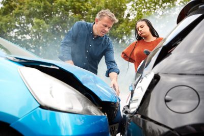 Two Angry Motorists Arguing Over Responsibility For Car Accident